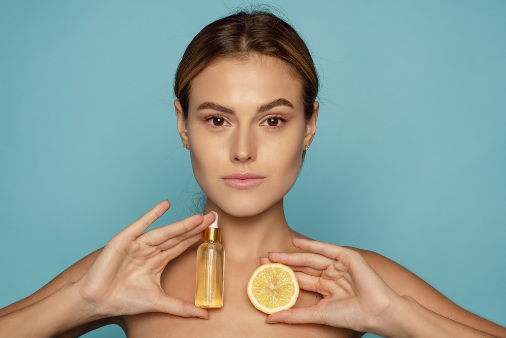 woman holding vitamin c